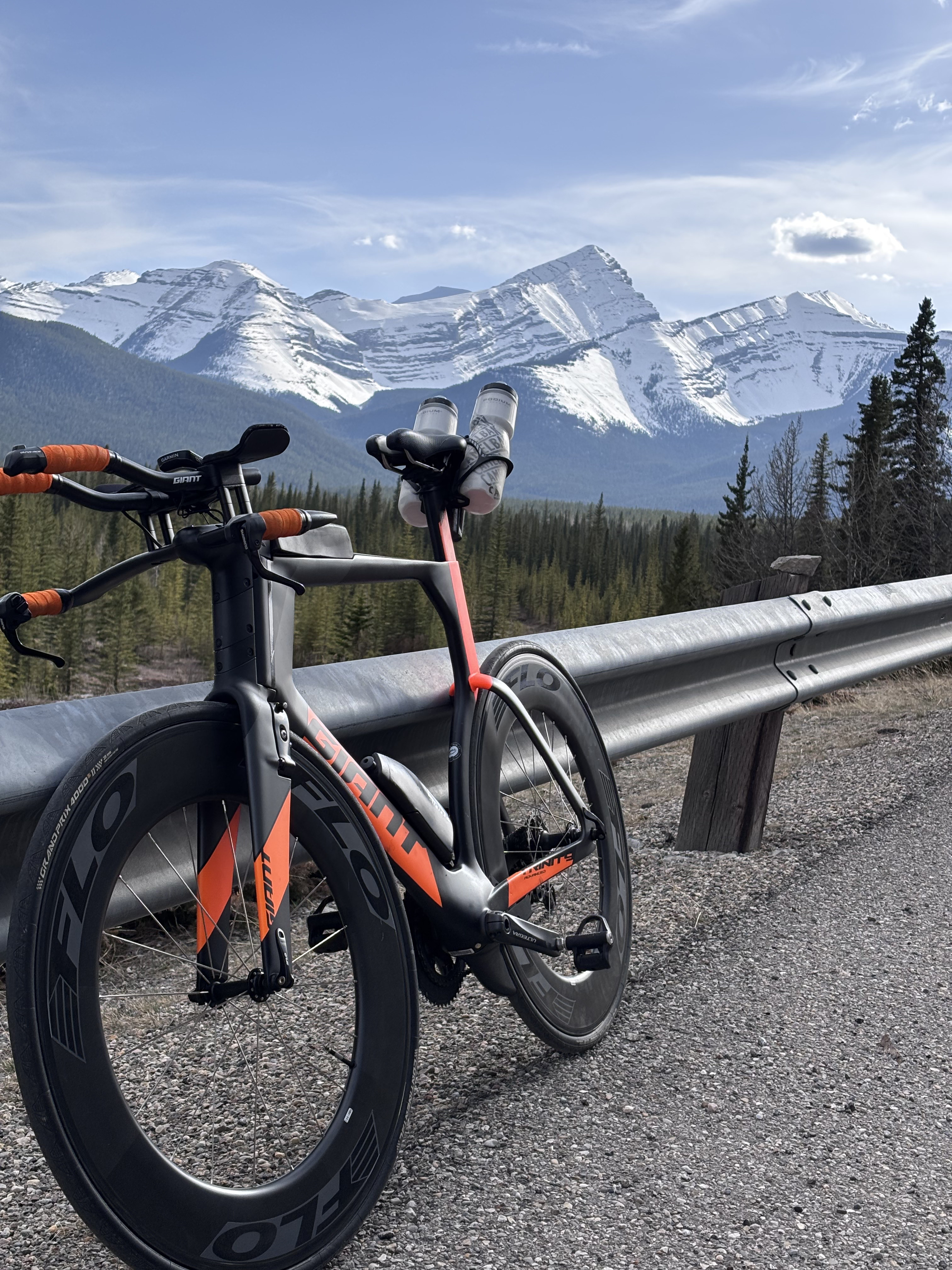 Martin Lavigne cycling with snowy Rockies backdrop