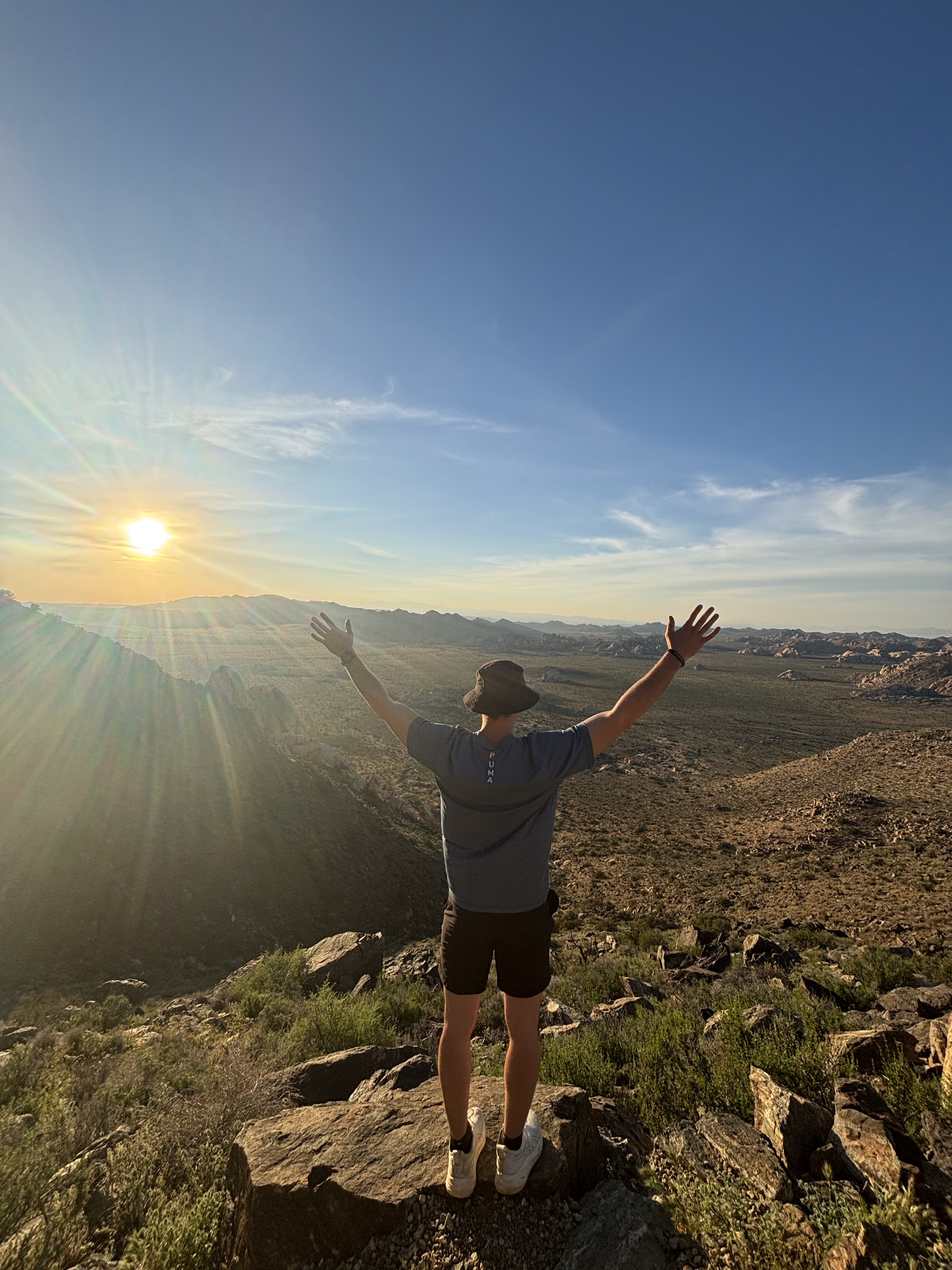 Martin Lavigne arms up at desert sunset