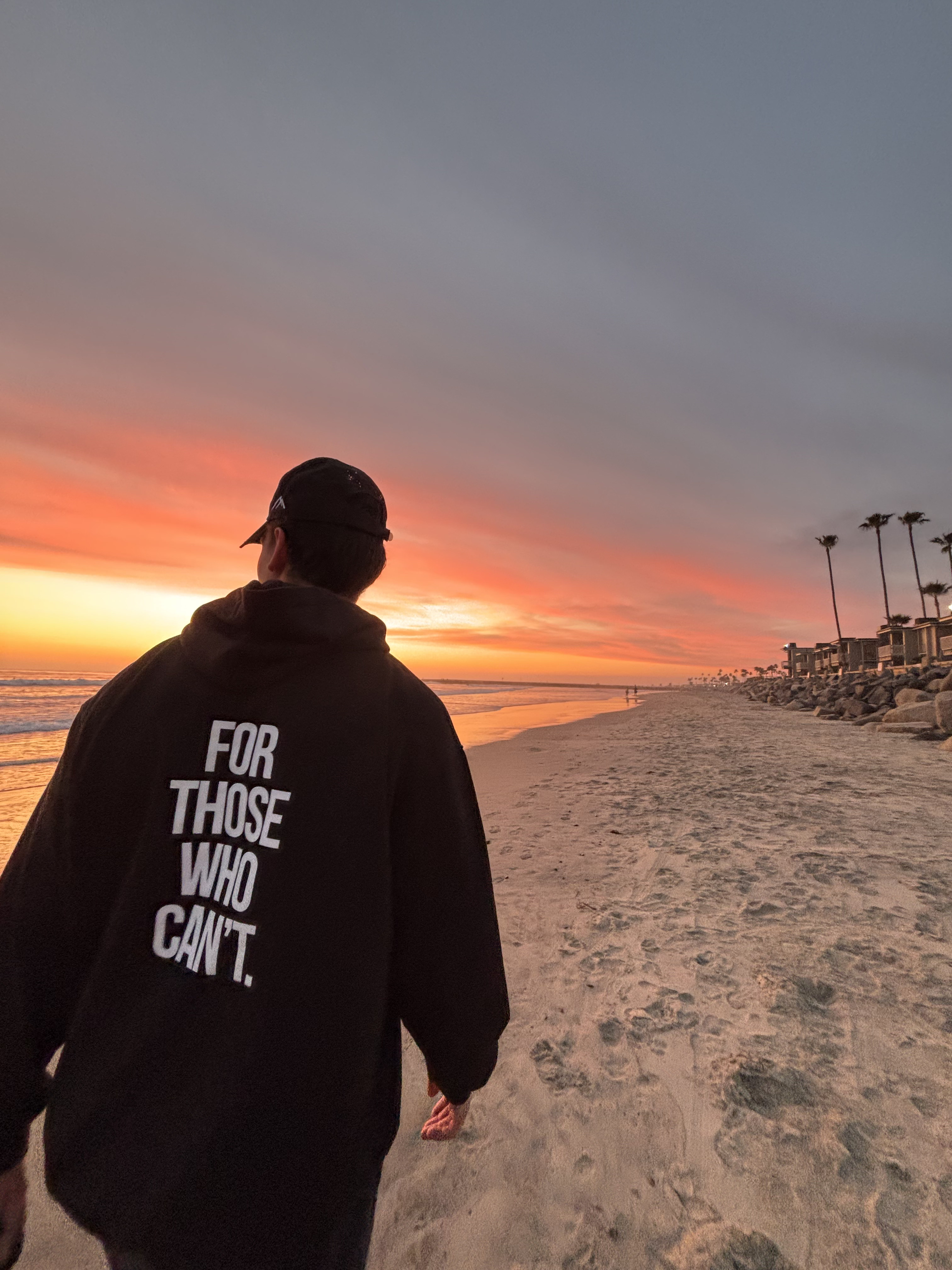 Martin Lavigne at Oceanside sunset wearing For Those Who Can't hoodie